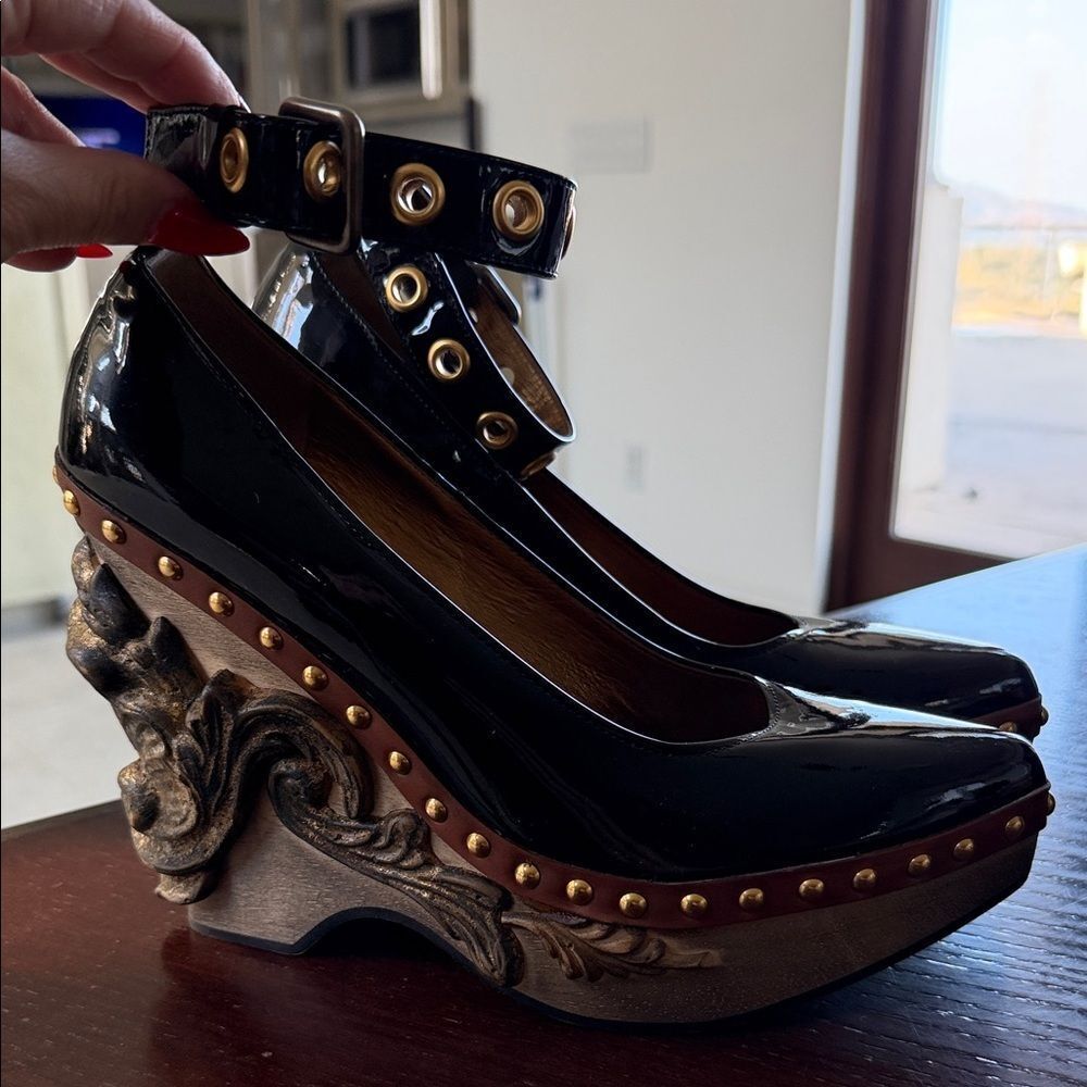 Miu Miu Black Heels with Sculpted Gold Accents